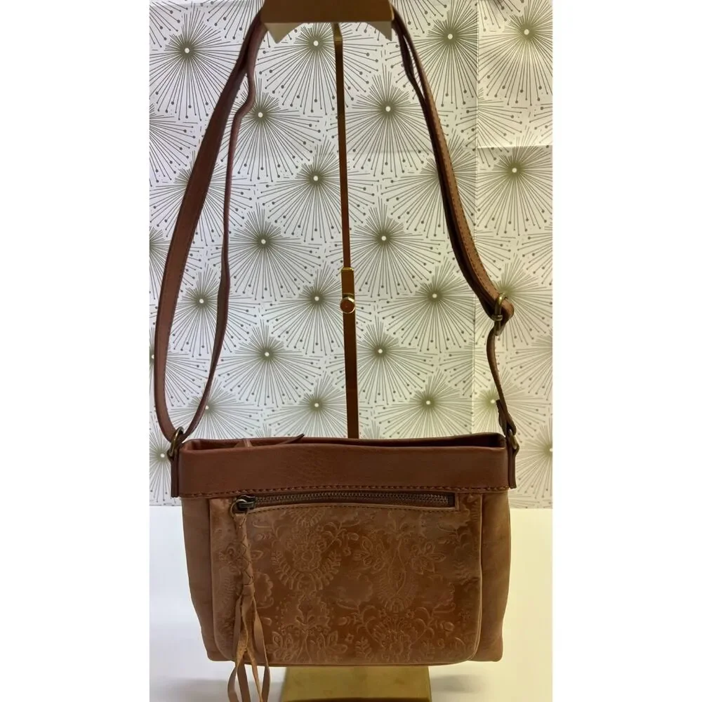 The Sak matte floral embossed tan leather Sanibel crossbody bag